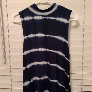 Navy shirt with open back and tie. White stripes. Size Medium.